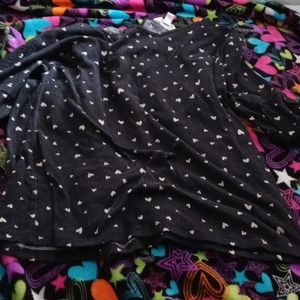 A black shirt with white hearts